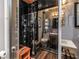 Sleek shower with multiple jets, black tile, and a built-in bench in modern bathroom at 145 19Th Se Ave, St Petersburg, FL 33705