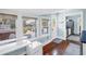 Bright sunroom boasting large windows and glass doors to a patio space, adjacent to kitchen area at 145 19Th Se Ave, St Petersburg, FL 33705
