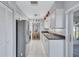 Well-equipped kitchen with stainless steel appliances, white cabinetry, and sleek countertops at 1496 Queen Anne Dr, Palm Harbor, FL 34684