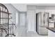 Bright kitchen featuring stainless steel appliances, white cabinets, and tile flooring at 1496 Queen Anne Dr, Palm Harbor, FL 34684