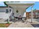 Cozy covered patio with table and chairs, ideal for relaxing and enjoying the outdoors at 1726 25Th S Ave, St Petersburg, FL 33712