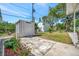 This backyard showcases a storage shed and lush greenery, creating a private outdoor space at 1726 25Th S Ave, St Petersburg, FL 33712