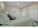 Relaxing bedroom featuring a comfortable bed with decorative pillows and light-colored walls at 1726 25Th S Ave, St Petersburg, FL 33712