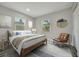 Comfortable bedroom with natural light, wood flooring and soothing neutral color scheme at 1726 25Th S Ave, St Petersburg, FL 33712