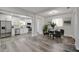 Open floor plan view of the kitchen and dining area with stainless appliances and modern finishes at 1726 25Th S Ave, St Petersburg, FL 33712