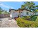Inviting front entrance showcasing a bright exterior, neat landscaping, and a charming covered porch at 1726 25Th S Ave, St Petersburg, FL 33712