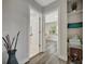 Open hallway that showcases the interior doors and access to adjacent rooms and interior decor at 1726 25Th S Ave, St Petersburg, FL 33712