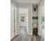 Hallway with storage shelves leading to a bedroom with natural light at 1726 25Th S Ave, St Petersburg, FL 33712