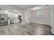 Open layout with the kitchen and dining area featuring stainless steel appliances and modern lighting at 1726 25Th S Ave, St Petersburg, FL 33712