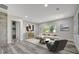 Contemporary living room boasts wood flooring and large windows, filling the space with natural light at 1726 25Th S Ave, St Petersburg, FL 33712
