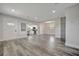 Open floor plan featuring a large living room with modern gray flooring, recessed lighting, and entry to the kitchen at 1726 25Th S Ave, St Petersburg, FL 33712