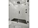 Modern glass enclosed shower with black honeycomb tile at 1726 25Th S Ave, St Petersburg, FL 33712