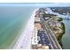 Breathtaking aerial view showcasing beachfront residences, shoreline, and waterways at 18650 Gulf Blvd # 303, Indian Shores, FL 33785
