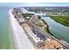 Expansive aerial view of pristine beachfront property with beautiful ocean views at 18650 Gulf Blvd # 303, Indian Shores, FL 33785