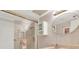 Bathroom featuring a vanity, round mirror, shower with glass doors, and soft lighting, creating a fresh space at 18650 Gulf Blvd # 303, Indian Shores, FL 33785