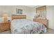 Relaxing bedroom features a dresser with mirror, a comfortable bed, and a relaxing atmosphere at 18650 Gulf Blvd # 303, Indian Shores, FL 33785
