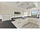 Bright kitchen featuring white cabinets, black countertops, and modern appliances at 18650 Gulf Blvd # 303, Indian Shores, FL 33785