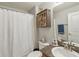 Bathroom features a shower with curtain, a cabinet, a mirror and sink at 20224 Natures Spirit Dr, Tampa, FL 33647