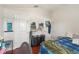 Bedroom features bed with a blue plaid comforter, and storage shelves at 20224 Natures Spirit Dr, Tampa, FL 33647