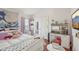 Bedroom features a cozy bed, and a white desk with storage at 20224 Natures Spirit Dr, Tampa, FL 33647