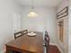 Cozy dining area features a wood table and chairs and a wine cellar rack on the wall at 20224 Natures Spirit Dr, Tampa, FL 33647