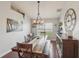 Elegant dining room featuring hardwood floors, a large wooden table, and stylish decor at 20224 Natures Spirit Dr, Tampa, FL 33647