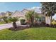 Beautiful single-Gathering home with lush landscaping, a two-car garage, and a welcoming entrance at 20224 Natures Spirit Dr, Tampa, FL 33647