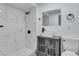 Modern bathroom with white-tiled shower, gray vanity, and vessel sink at 2107 E 93Rd Ave, Tampa, FL 33612