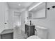 Modern bathroom features a vessel sink, gray vanity, and neutral color scheme at 2107 E 93Rd Ave, Tampa, FL 33612