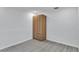 Bedroom showcasing modern wardrobe cabinet and light wood-look floors at 2107 E 93Rd Ave, Tampa, FL 33612