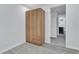 Neutral bedroom featuring a built-in closet with gray floors and ample space at 2107 E 93Rd Ave, Tampa, FL 33612