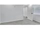 This bedroom has gray floors, white walls and a sunny window at 2107 E 93Rd Ave, Tampa, FL 33612