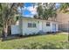 A charming single-story home featuring a well-maintained lawn and privacy fence at 2107 E 93Rd Ave, Tampa, FL 33612