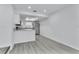 Modern kitchen with stone countertops, stainless steel appliances, and a skylight at 2107 E 93Rd Ave, Tampa, FL 33612