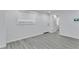 Bright living room featuring neutral paint and modern flooring at 2107 E 93Rd Ave, Tampa, FL 33612
