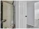View of HVAC system and utility closet with a white door and black hardware at 2107 E 93Rd Ave, Tampa, FL 33612