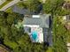 Community amenities including a pool and shuffleboard courts, surrounded by lush greenery at 2127 Scotland Dr, Clearwater, FL 33763