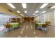 The bright clubhouse has a stage, tables, and chairs for community activities and social gatherings at 2127 Scotland Dr, Clearwater, FL 33763