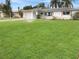 Well-maintained lawn and landscaping surrounds this single story home featuring a one car garage at 2127 Scotland Dr, Clearwater, FL 33763