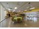 Spacious community recreation room with tables, chairs, and a disco ball for entertainment at 2127 Scotland Dr, Clearwater, FL 33763