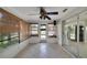 Bright sun room with sliding glass door leading to the kitchen and an exterior door at 2127 Scotland Dr, Clearwater, FL 33763