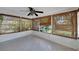 Bright sun room featuring tile flooring, and windows with bamboo shades at 2127 Scotland Dr, Clearwater, FL 33763