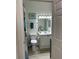 Bathroom with a toilet, a shower with a patterned curtain, and a white vanity at 2220 Chianti Pl # 8-0817, Palm Harbor, FL 34683