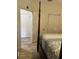 Bedroom with four poster bed, neutral walls, and access to other rooms at 2220 Chianti Pl # 8-0817, Palm Harbor, FL 34683