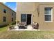 Cozy patio with outdoor seating, ideal for relaxing and enjoying the serene backyard setting at 2221 Broadway View Ave, Brandon, FL 33510