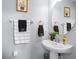 Charming bathroom features a pedestal sink, tasteful decor, and functional fixtures at 2221 Broadway View Ave, Brandon, FL 33510