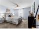 Comfortable bedroom with plush carpet, ceiling fan, stylish decor, and a relaxing atmosphere at 2221 Broadway View Ave, Brandon, FL 33510