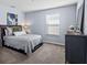 Inviting bedroom with soft carpet, natural light, stylish decor, and a comfortable ambiance at 2221 Broadway View Ave, Brandon, FL 33510