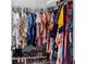 Organized walk-in closet with clothes, shoes, and accessories, providing ample storage space at 2221 Broadway View Ave, Brandon, FL 33510