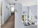 Open view of hallway showcases a view of the living room, with high ceilings and natural light at 2221 Broadway View Ave, Brandon, FL 33510